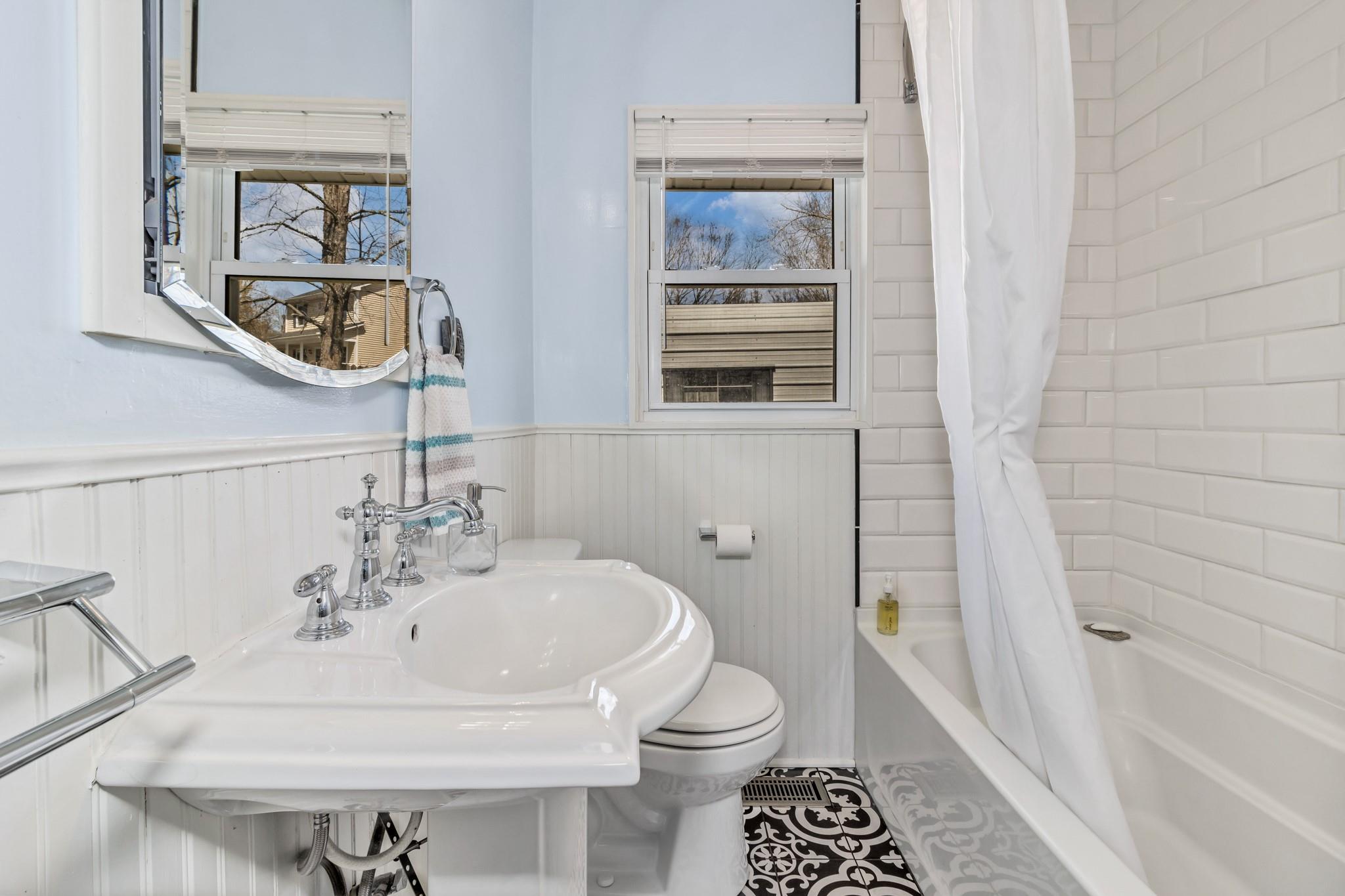 994 Riceville Road Asheville, NC 28805 - Photo 44 of 45 a bathroom with a sink and a mirror