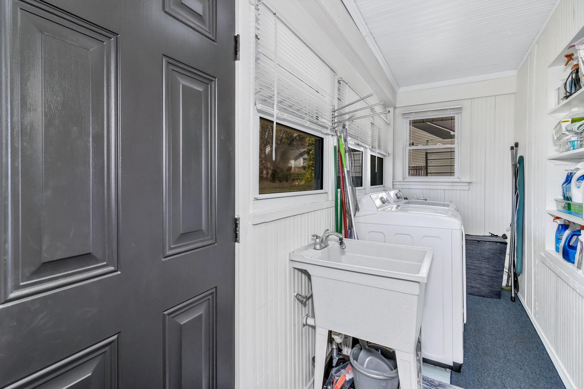 994 Riceville Road Asheville, NC 28805 - Photo 45 of 45 a bathroom with a sink a mirror and a toilet