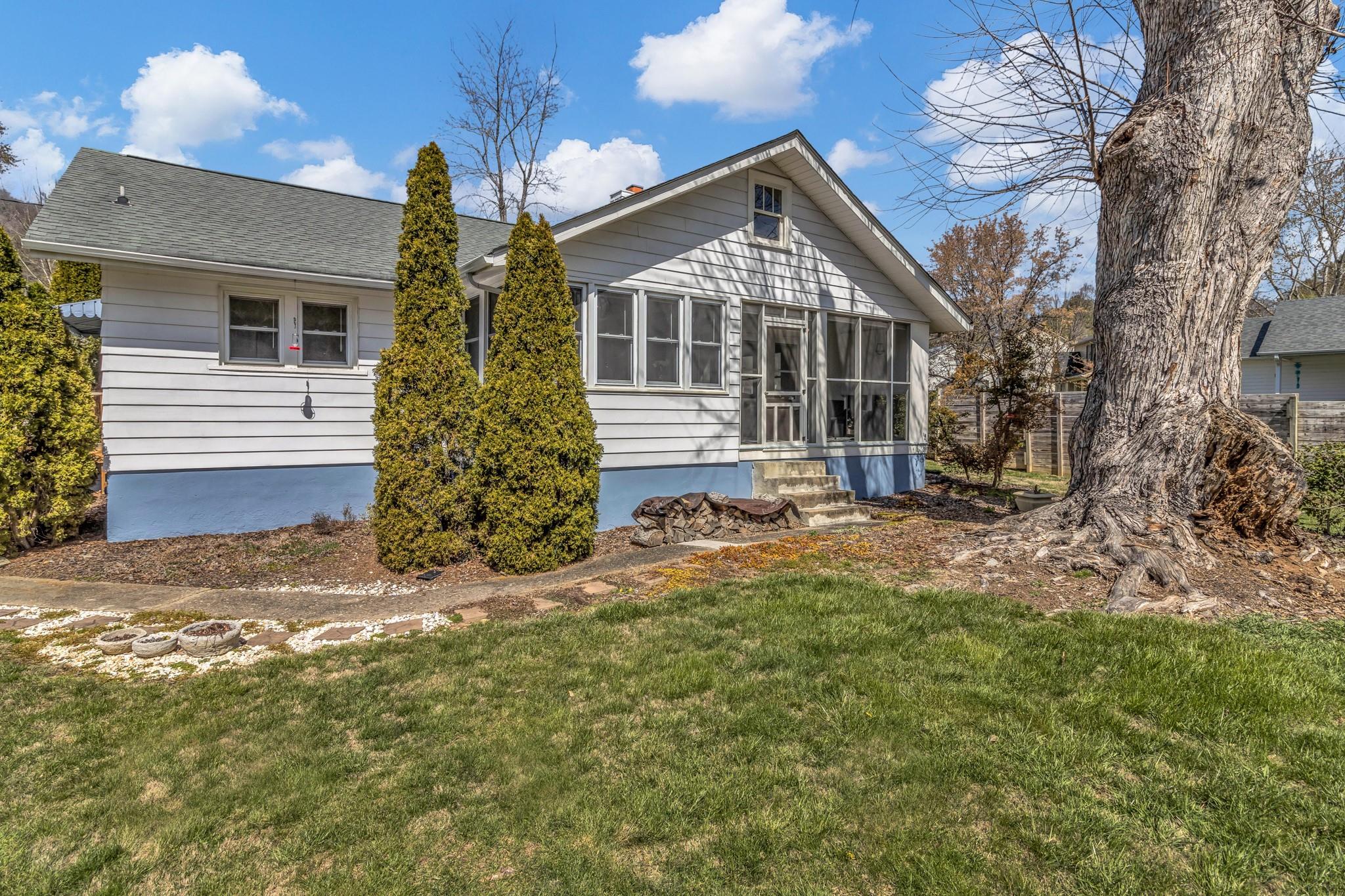 994 Riceville Road Asheville, NC 28805 - Photo 6 of 45 a front view of a house with a yard
