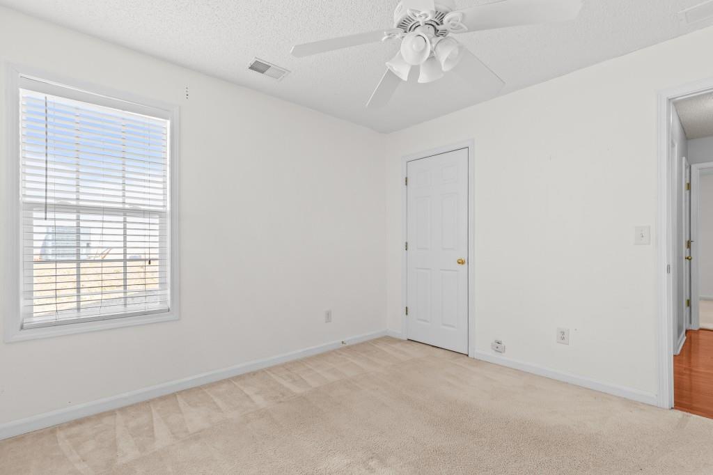 1707 Mountain Fort Way Dacula, GA 30019 - Photo 23 of 34 a view of an empty room with a window