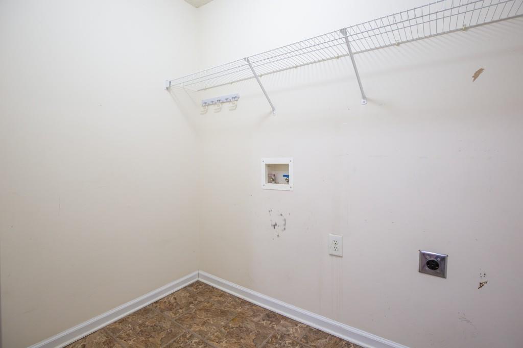 1707 Mountain Fort Way Dacula, GA 30019 - Photo 27 of 34 a view of a room with racks on the wall