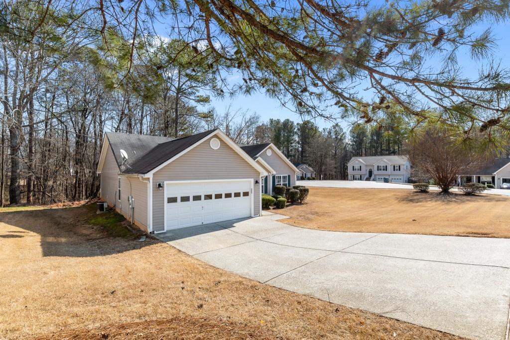 1707 Mountain Fort Way Dacula, GA 30019 - Photo 32 of 34 a view of residential houses with snow on the road