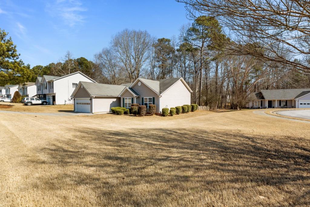 1707 Mountain Fort Way Dacula, GA 30019 - Photo 33 of 34 a view of residential houses with yard and road