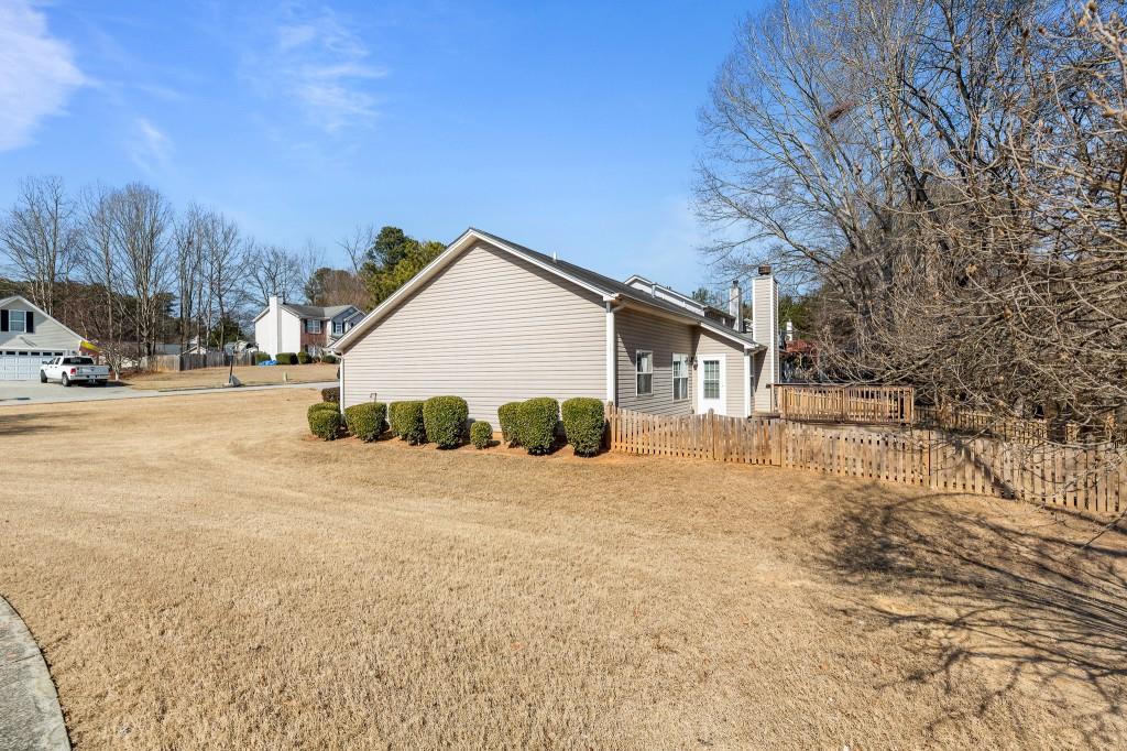 1707 Mountain Fort Way Dacula, GA 30019 - Photo 34 of 34 a view of a house with a yard covered in snow
