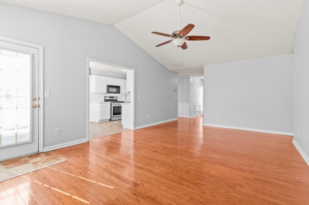 1707 Mountain Fort Way Dacula, GA 30019 - Photo 6 of 34 a view of empty room with wooden floor and ceiling fan