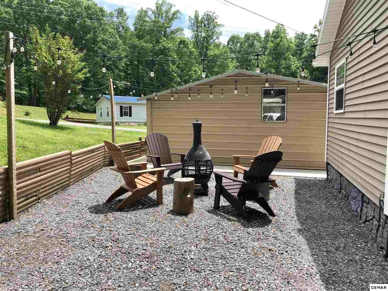 1403 Lin Creek Road Sevierville, TN 37876 - Photo 22 of 24 a view of a backyard with sitting area