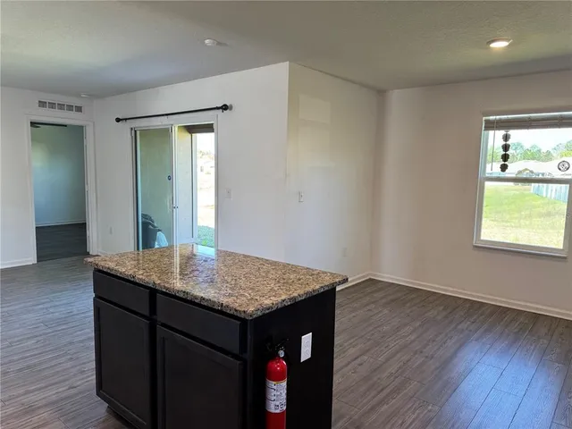 a view of kitchen island with wooden floor