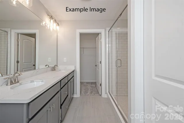 a bathroom with a double vanity sink and mirror