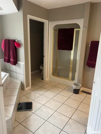 a bathroom with a shower and a mirror