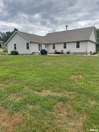 a front view of house with garden
