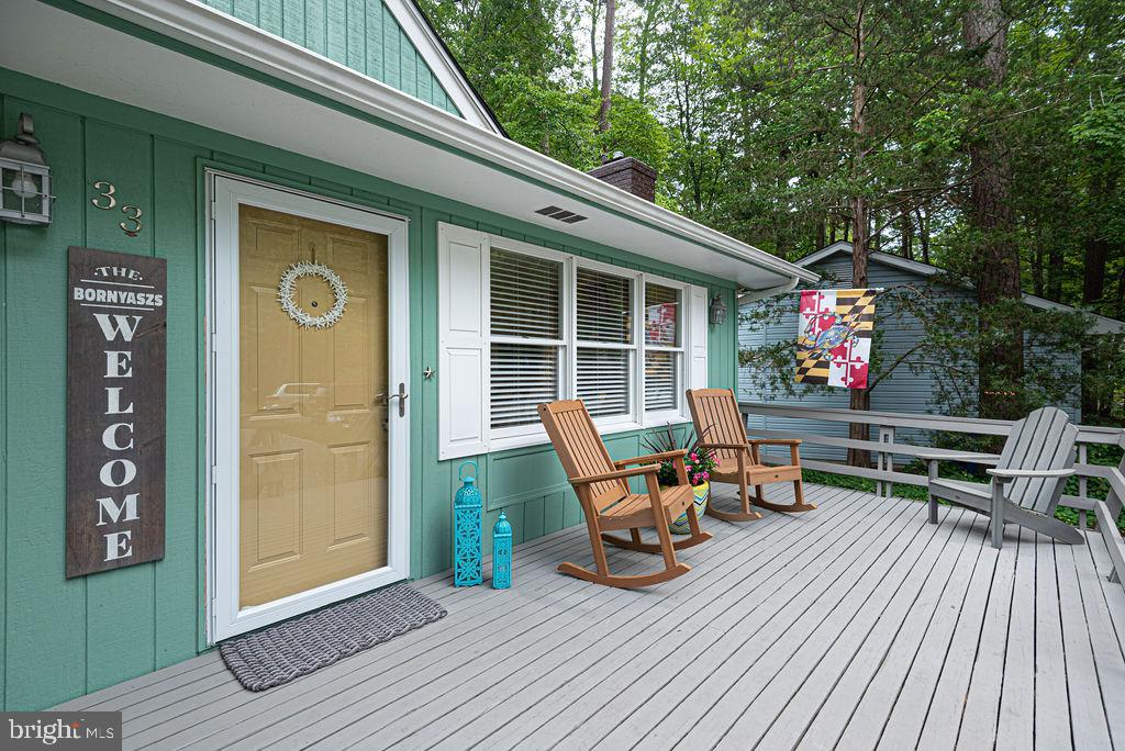 33 Falcon Bridge Road Ocean Pines, MD 21811 - Photo 8 of 71 a outdoor view with a sitting space and large trees