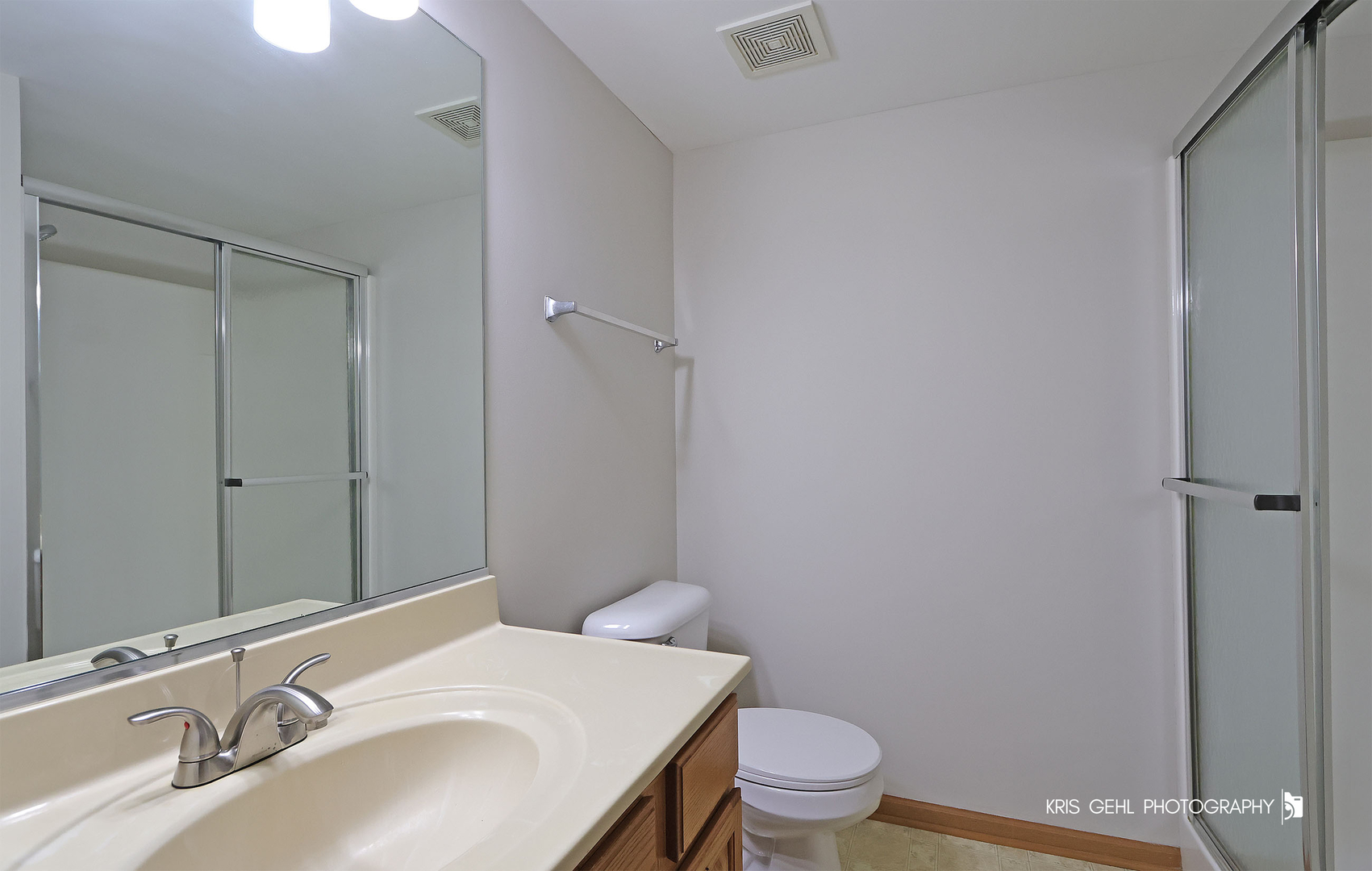 1038 Redondo Drive Romeoville, IL 60446 - Photo 12 of 23 a bathroom with a sink toilet and vanity