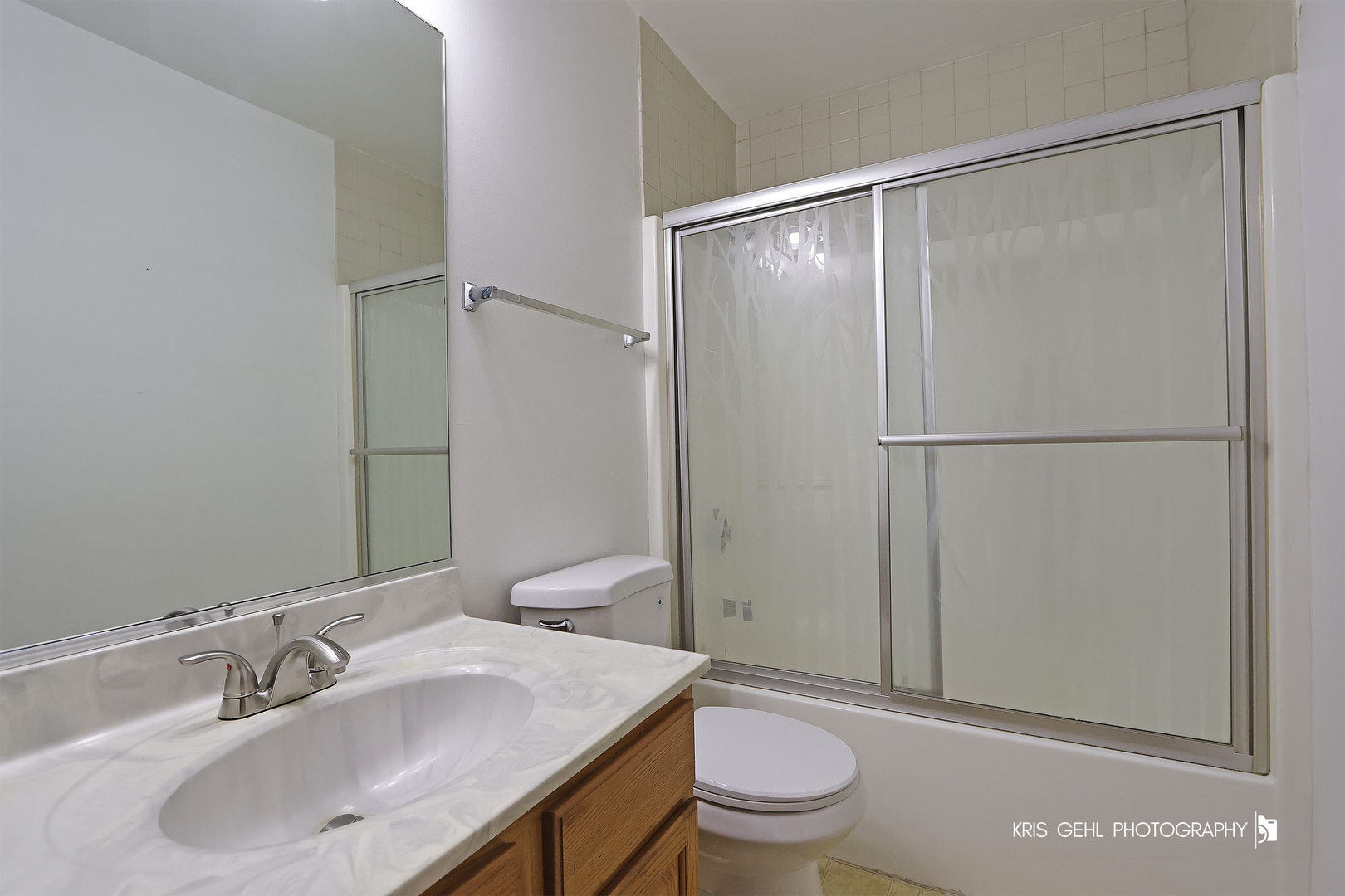 1038 Redondo Drive Romeoville, IL 60446 - Photo 17 of 23 a bathroom with a sink toilet and vanity