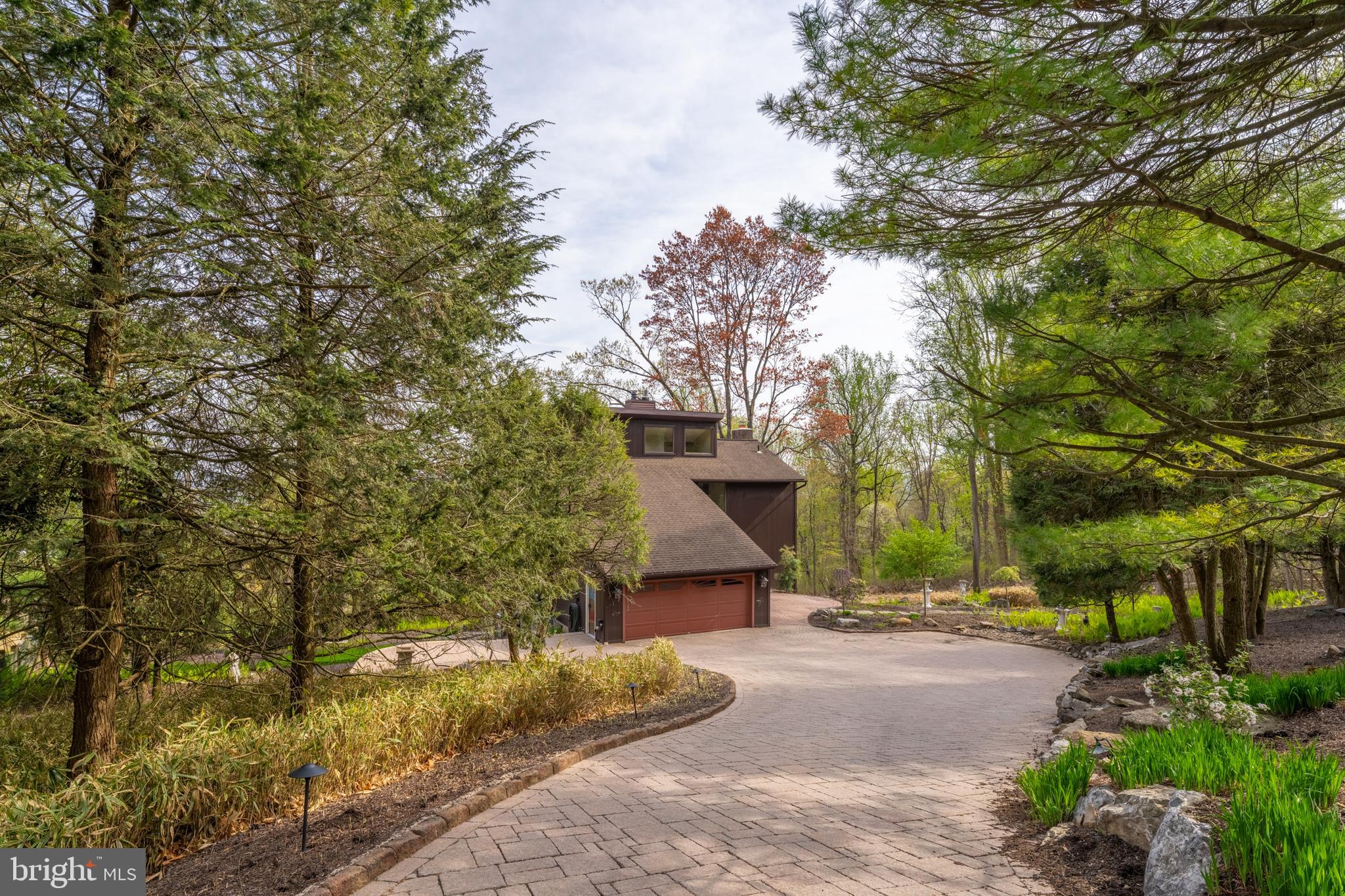 3446 Honeysuckle Road Bethlehem, PA 18015 - Photo 2 of 80 a front view of a house with a yard and trees