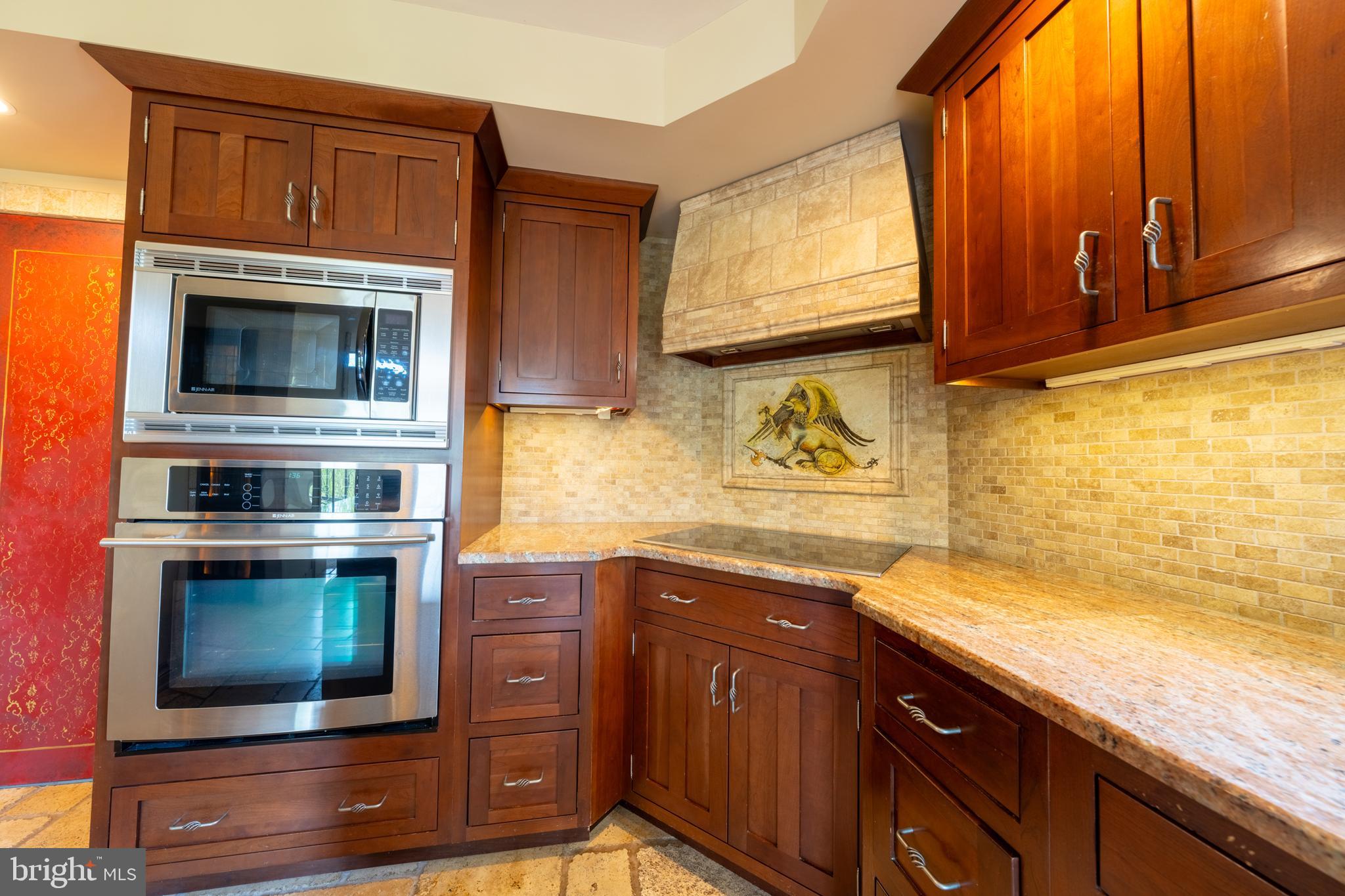 3446 Honeysuckle Road Bethlehem, PA 18015 - Photo 21 of 80 a kitchen with stainless steel appliances wooden cabinets and a stove top oven