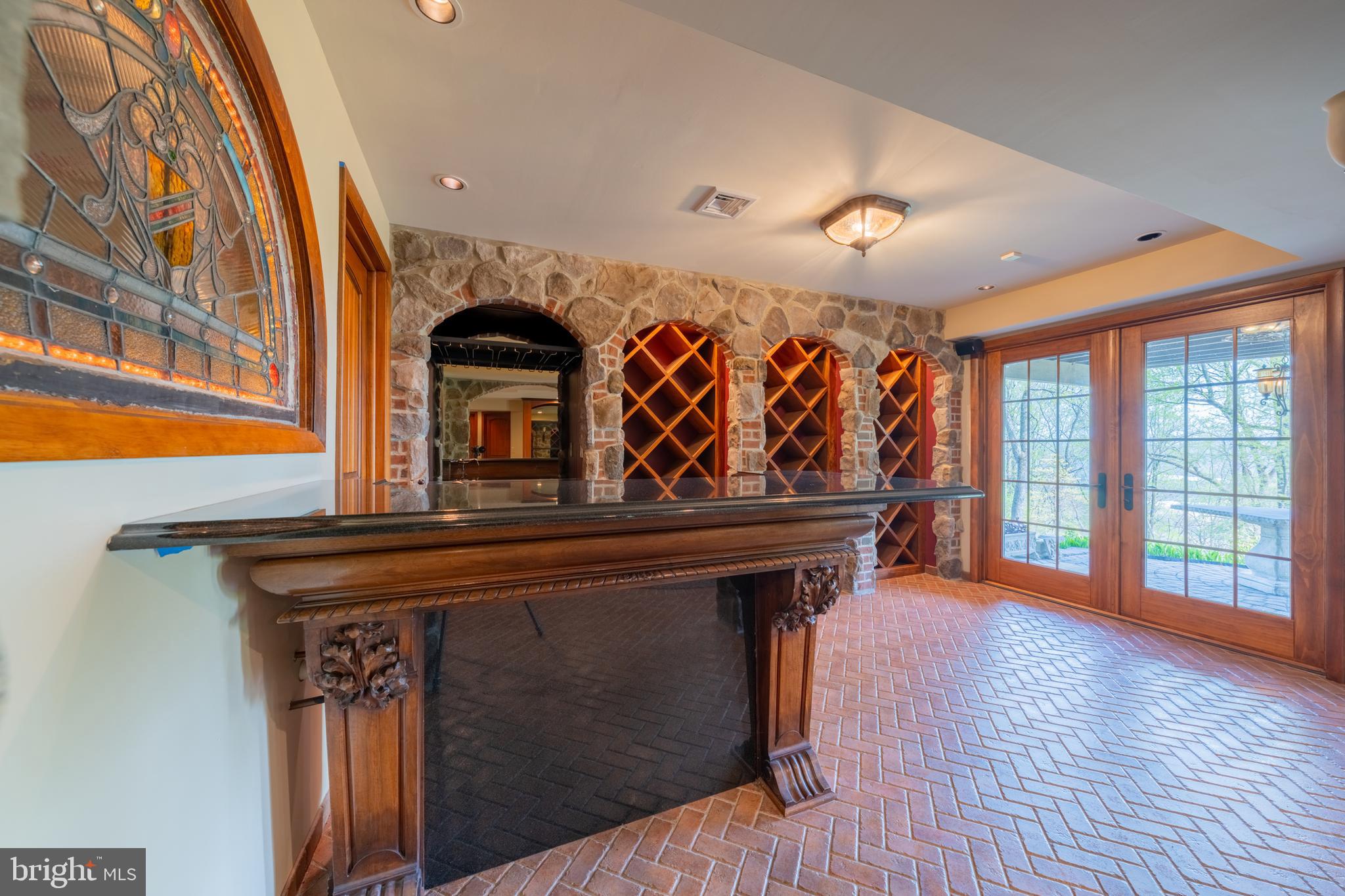 3446 Honeysuckle Road Bethlehem, PA 18015 - Photo 49 of 80 a view of a hallway with furniture and a fireplace