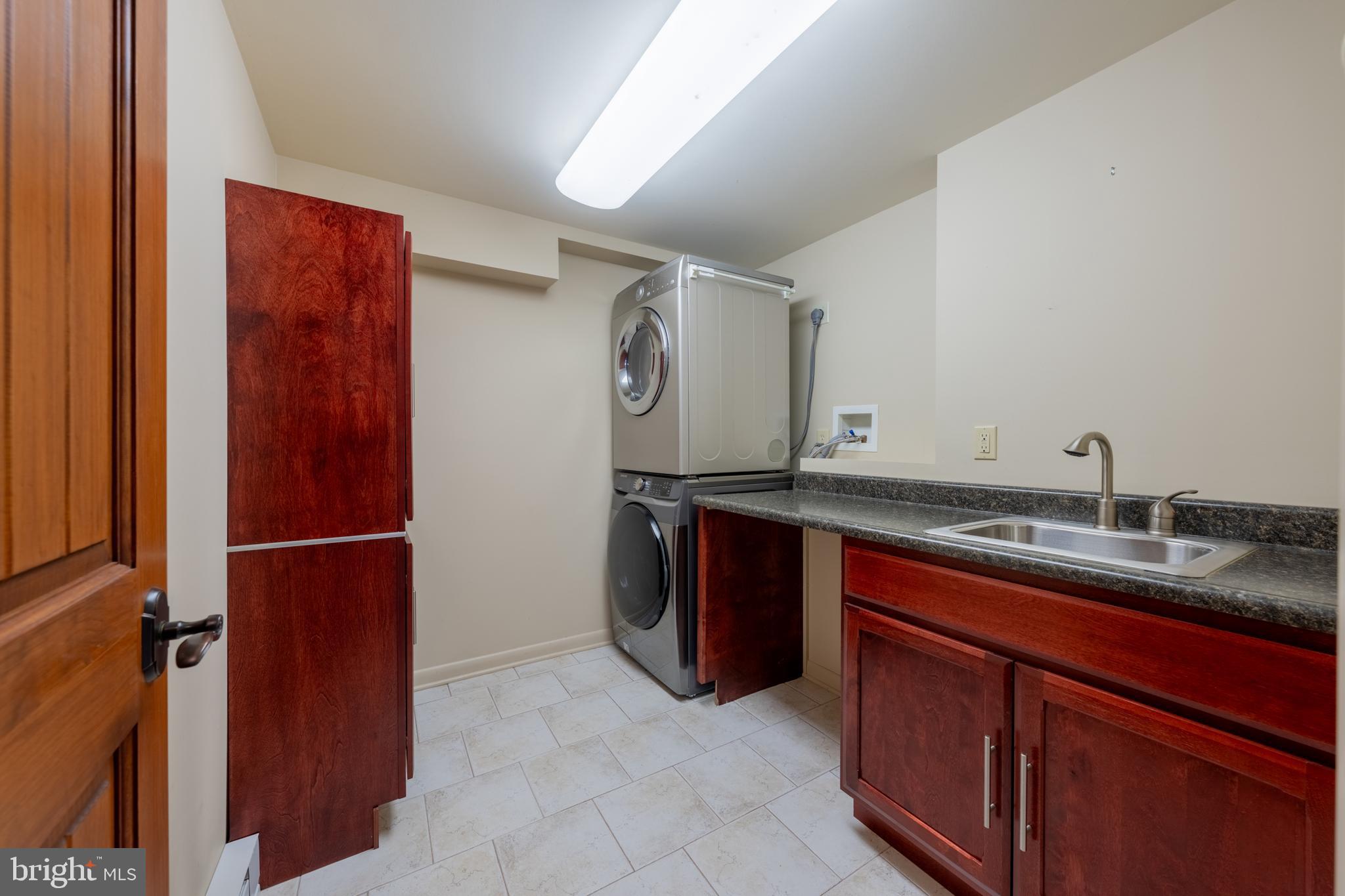 3446 Honeysuckle Road Bethlehem, PA 18015 - Photo 54 of 80 a bathroom with a granite countertop sink and a mirror