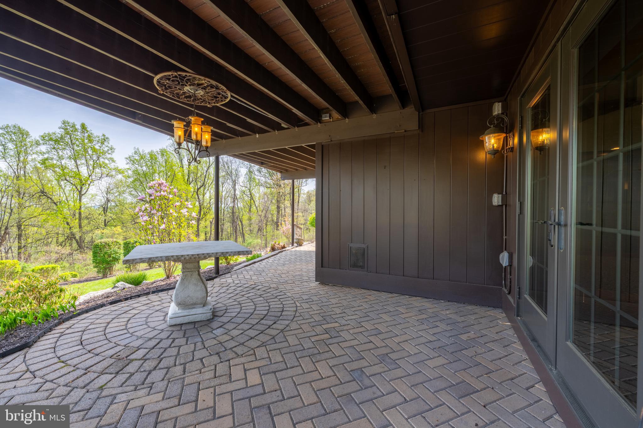 3446 Honeysuckle Road Bethlehem, PA 18015 - Photo 59 of 80 a view of a porch with a table and chairs