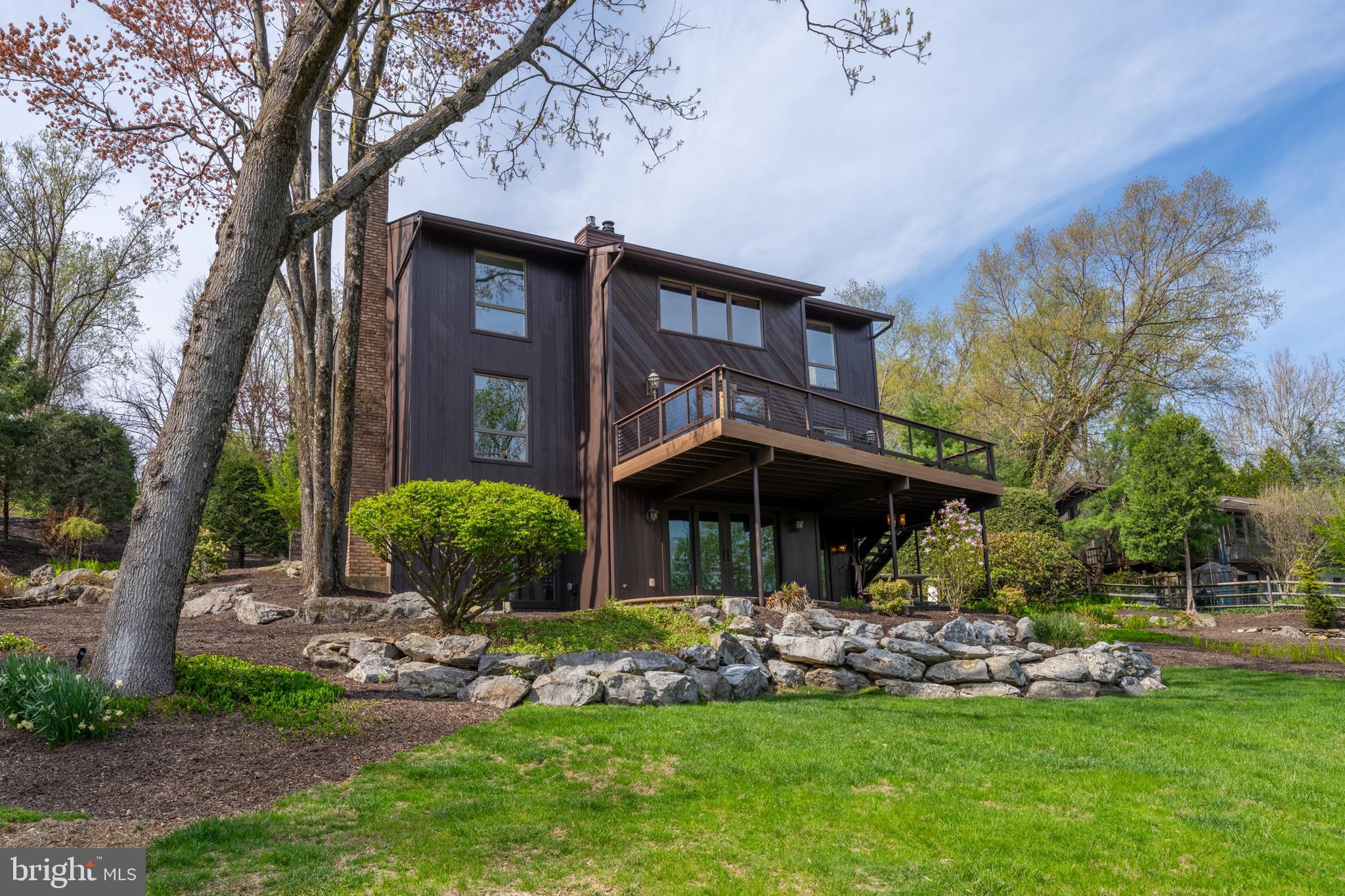 3446 Honeysuckle Road Bethlehem, PA 18015 - Photo 73 of 80 a front view of a house with a yard table and chairs