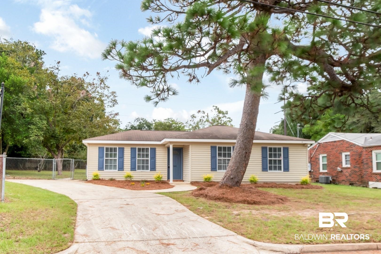 1611 Rochelle Street Mobile, AL 36693 - Photo 3 of 32 View of front facade with concrete driveway and a gate