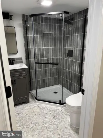 a front view of a house with outdoor seating