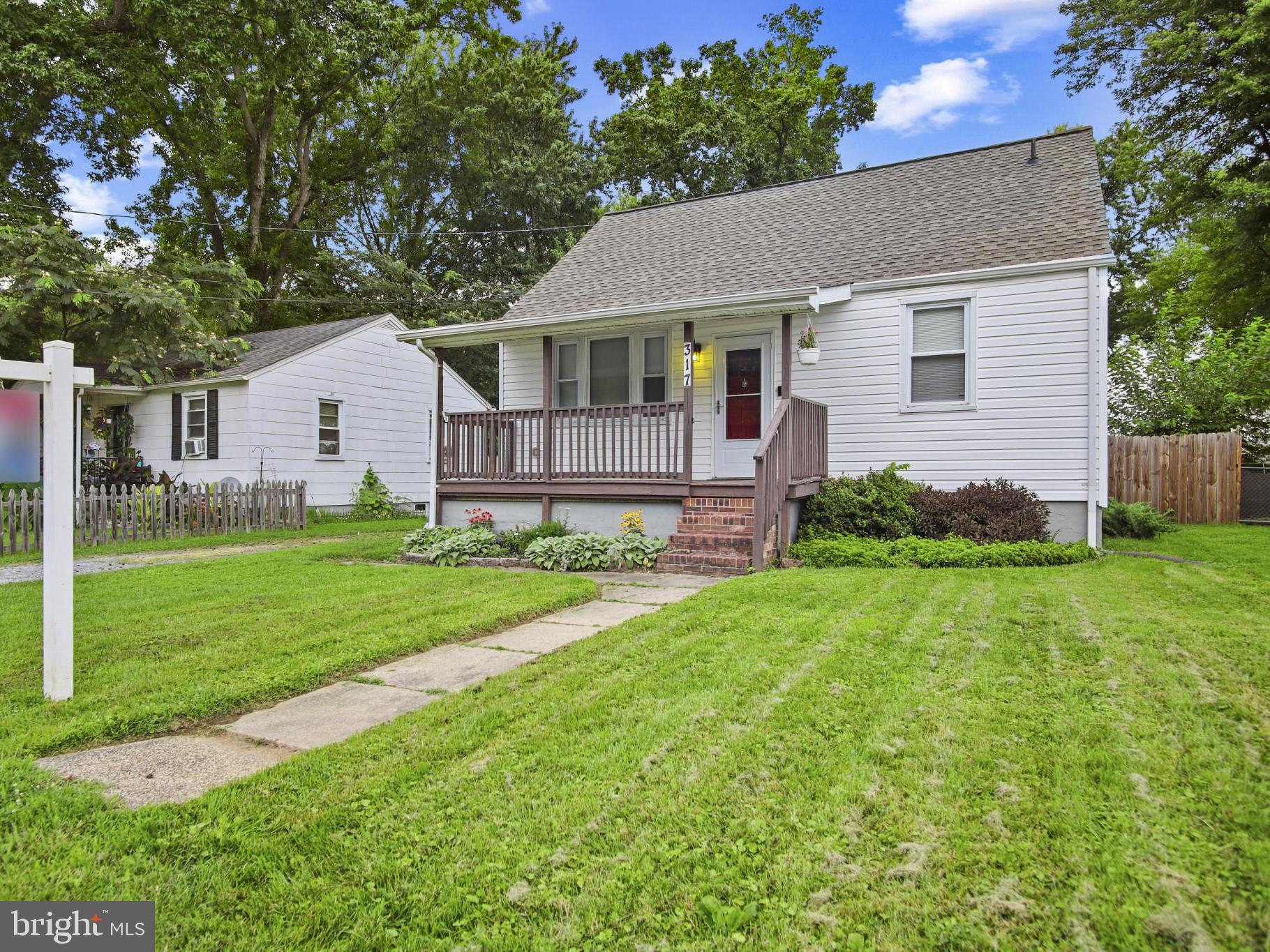 317 Wye Road Essex, MD 21221 - Photo 1 of 35 a front view of house with yard and green space