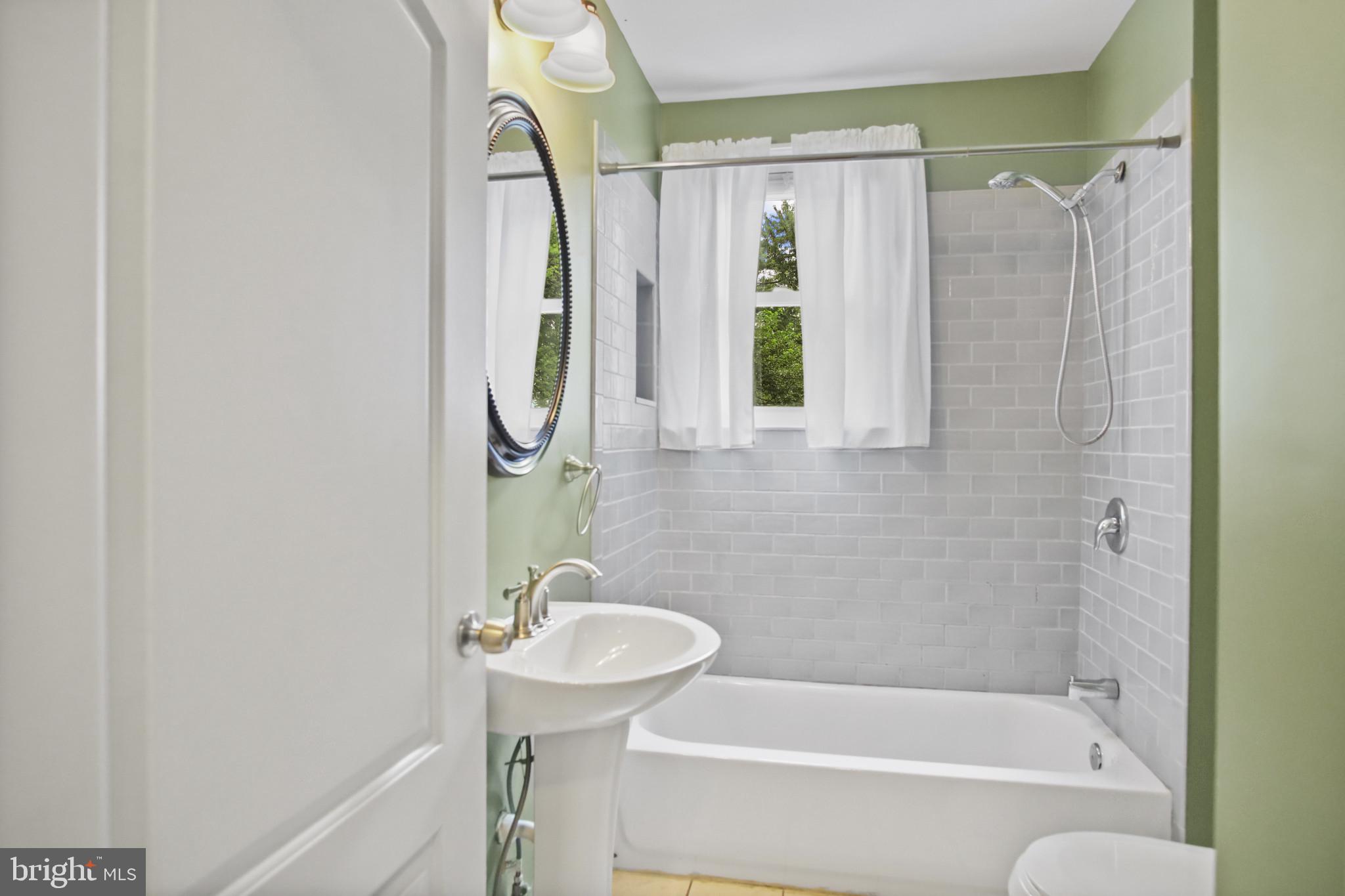 317 Wye Road Essex, MD 21221 - Photo 17 of 35 a bathroom with a sink toilet and shower