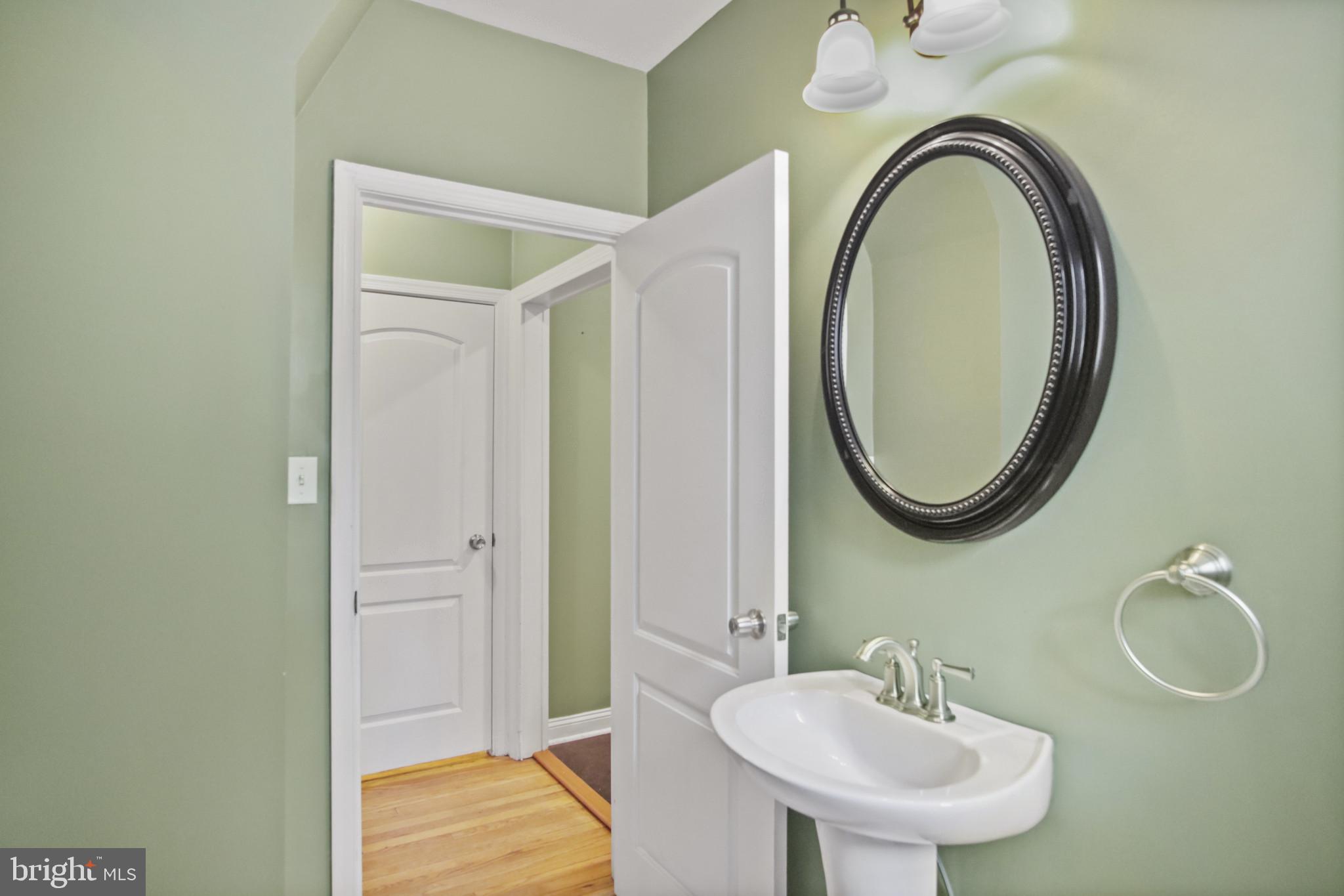 317 Wye Road Essex, MD 21221 - Photo 18 of 35 a bathroom with a sink and a mirror