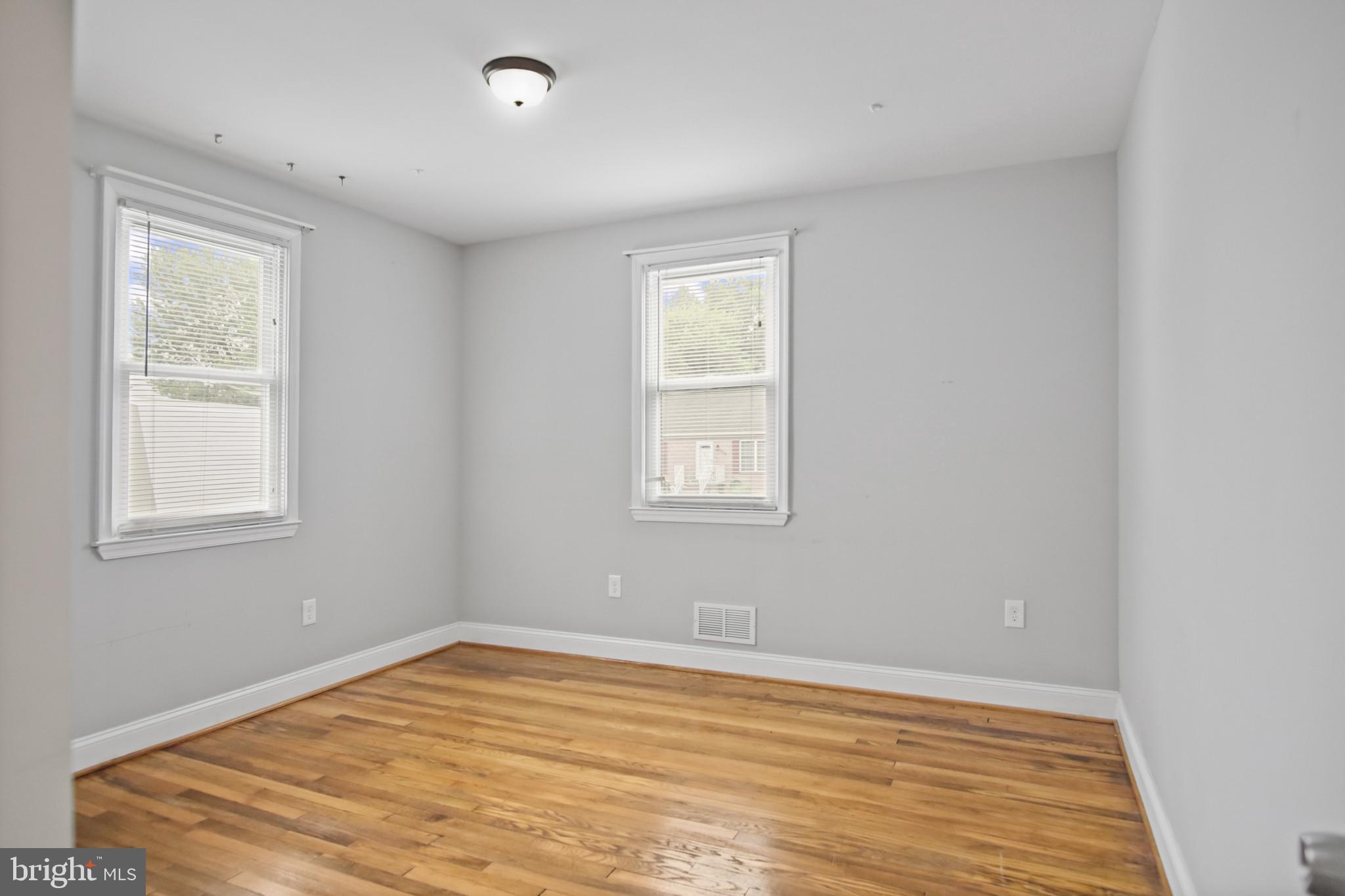 317 Wye Road Essex, MD 21221 - Photo 19 of 35 a view of empty room with wooden floor and fan