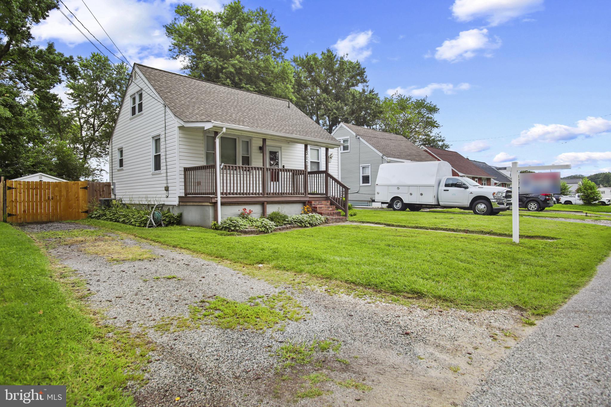 317 Wye Road Essex, MD 21221 - Photo 2 of 35 a front view of a house with a yard and trees