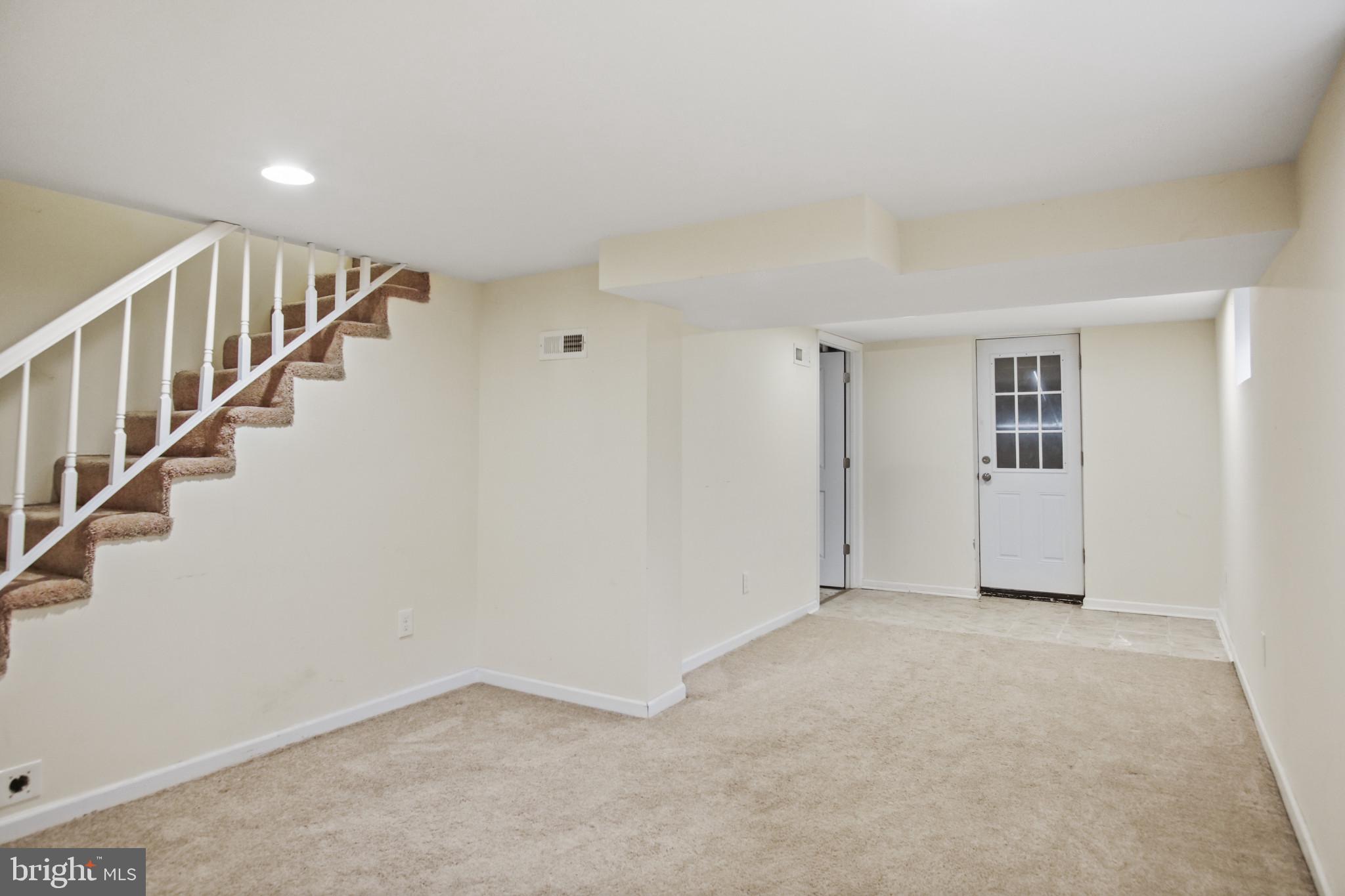 317 Wye Road Essex, MD 21221 - Photo 21 of 35 a view of an empty room with stairs