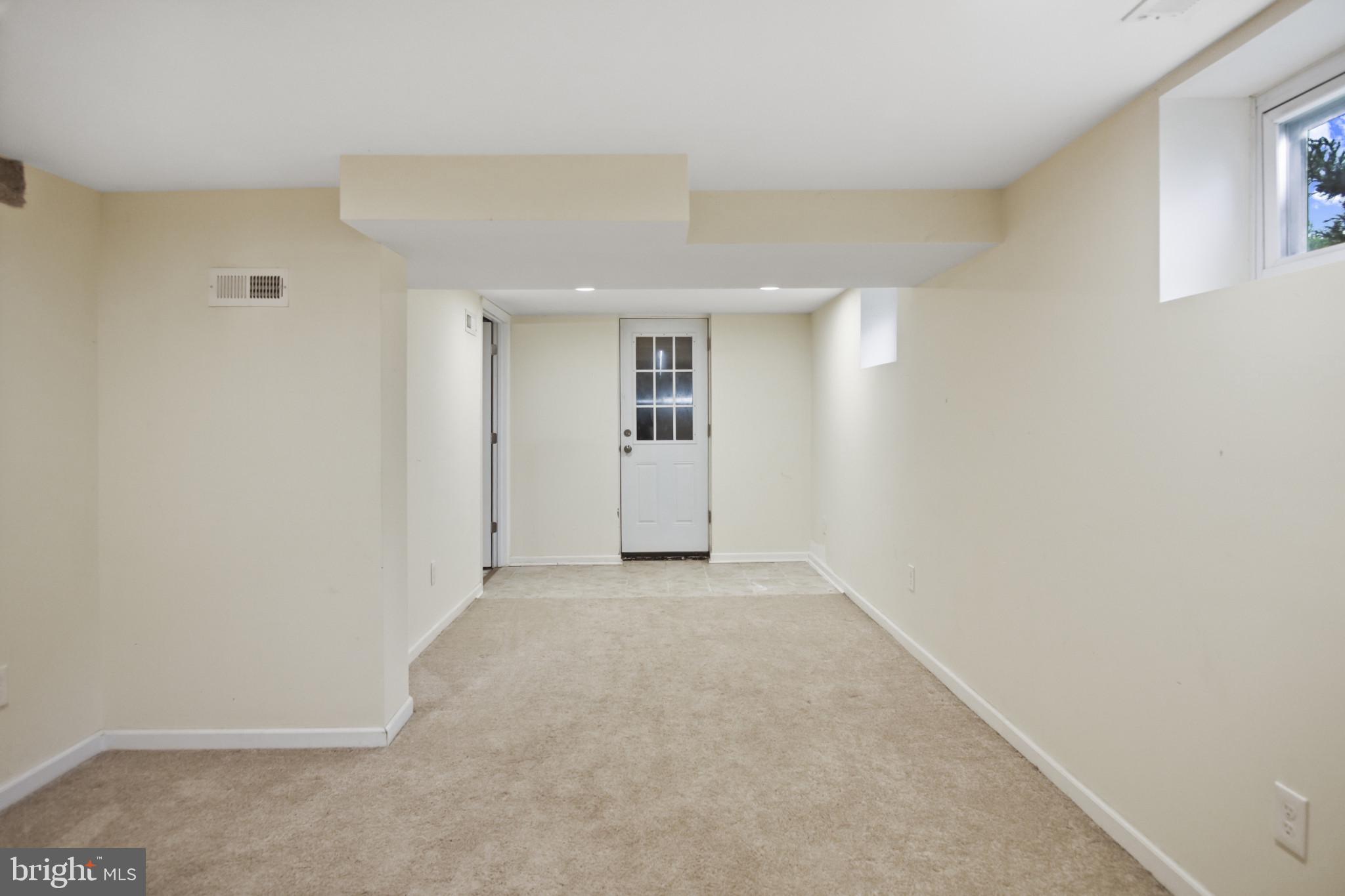 317 Wye Road Essex, MD 21221 - Photo 24 of 35 an empty room with windows
