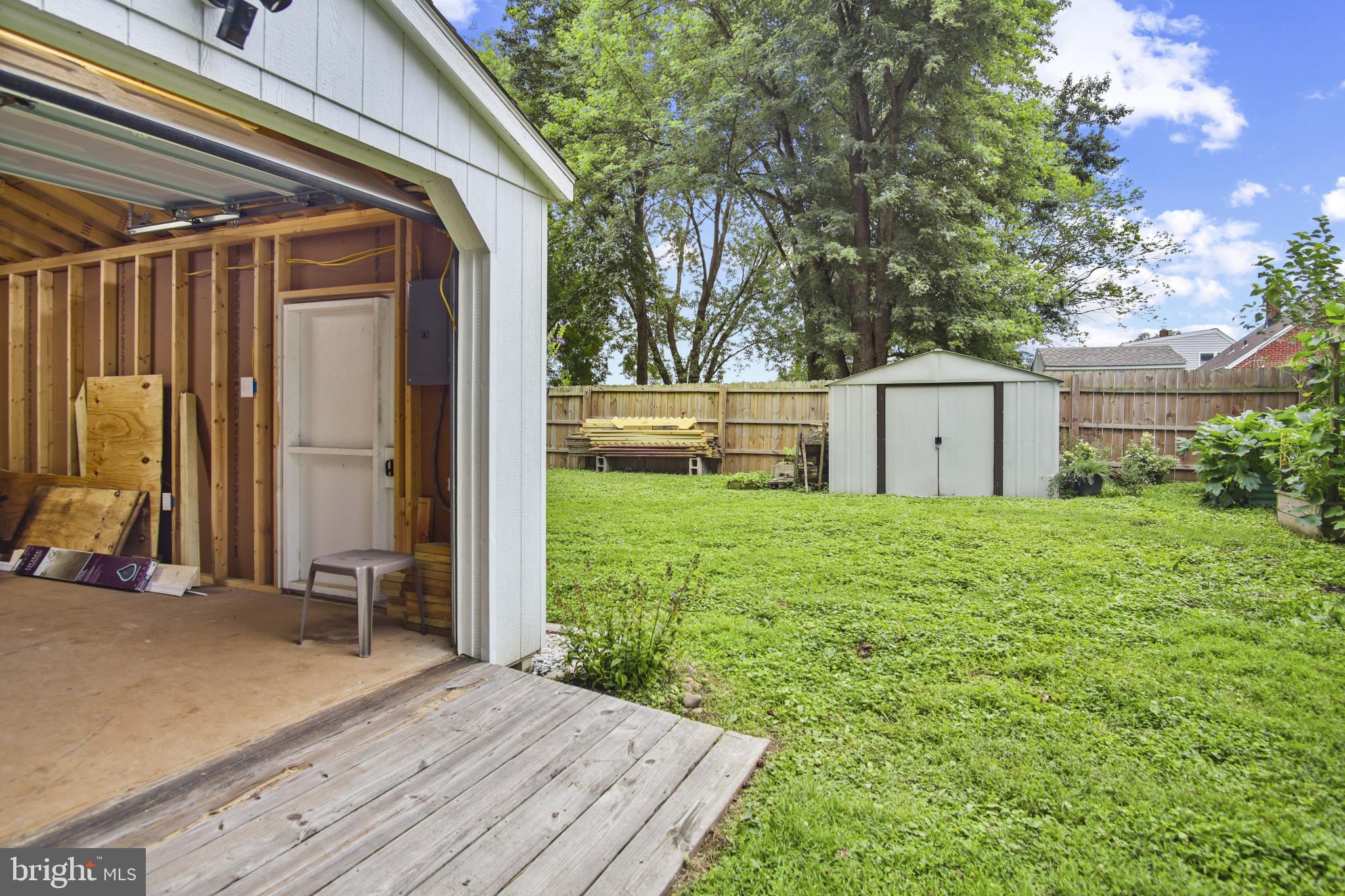 317 Wye Road Essex, MD 21221 - Photo 28 of 35 a view of backyard with large trees and wooden fence