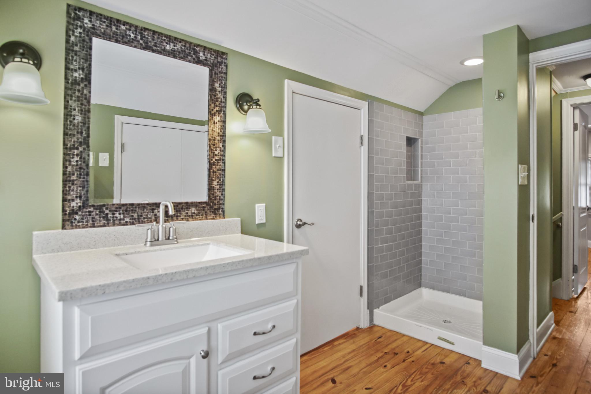 317 Wye Road Essex, MD 21221 - Photo 6 of 35 a bathroom with a sink a toilet and shower