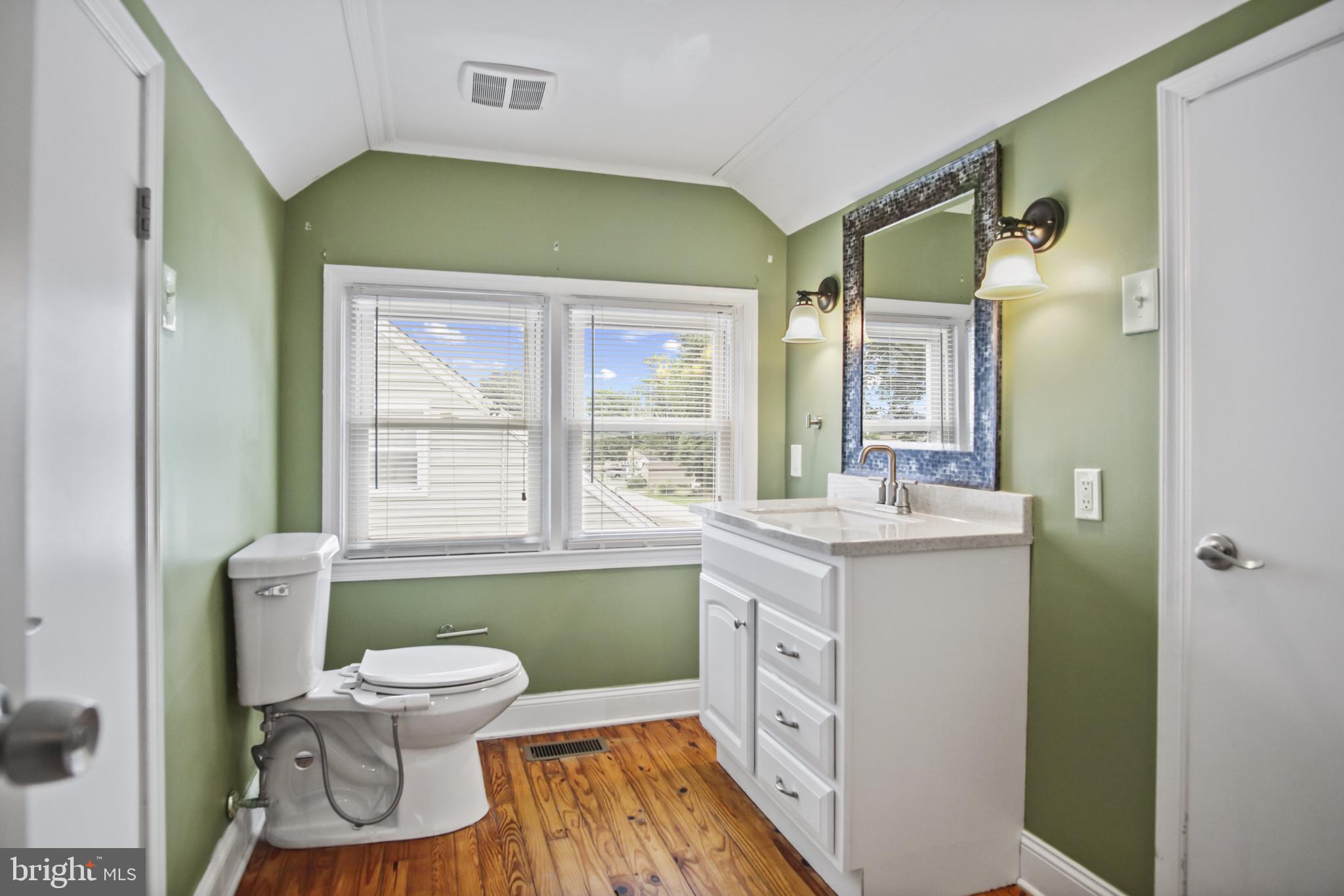 317 Wye Road Essex, MD 21221 - Photo 7 of 35 a bathroom with a sink toilet and a mirror