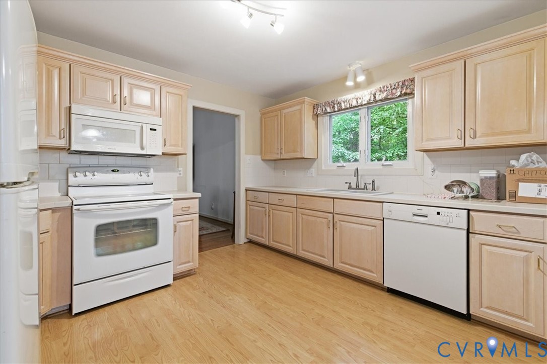 4099 Doe Run Road Hopewell, VA 23860 - Photo 6 of 36 Kitchen featuring wood-finish flooring, light-tone