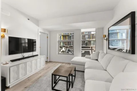 a living room with furniture and a flat screen tv