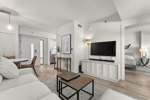 a living room with furniture and a flat screen tv