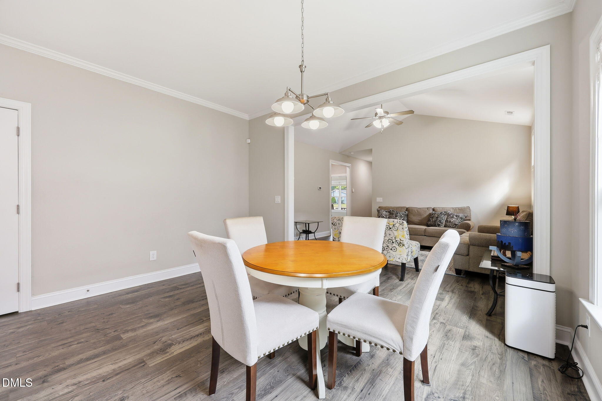 709 South Pollock Street Selma, NC 27576 - Photo 11 of 30 a view of a dining room with furniture and wooden floor