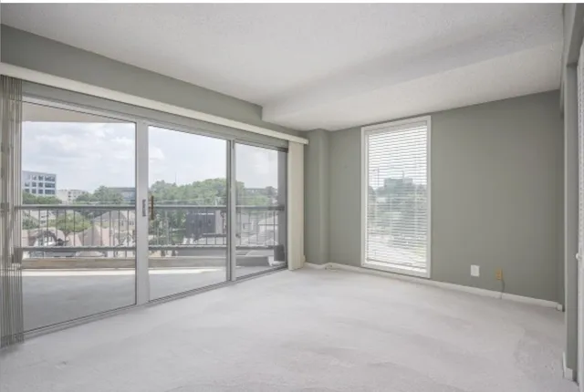 a view of an empty room with windows