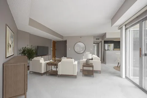 a living room with furniture a table and chairs