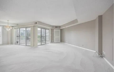 a view of an empty room with a balcony