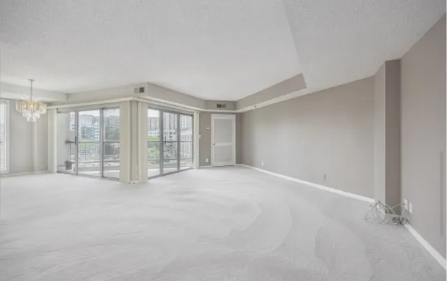 a view of an empty room with a balcony