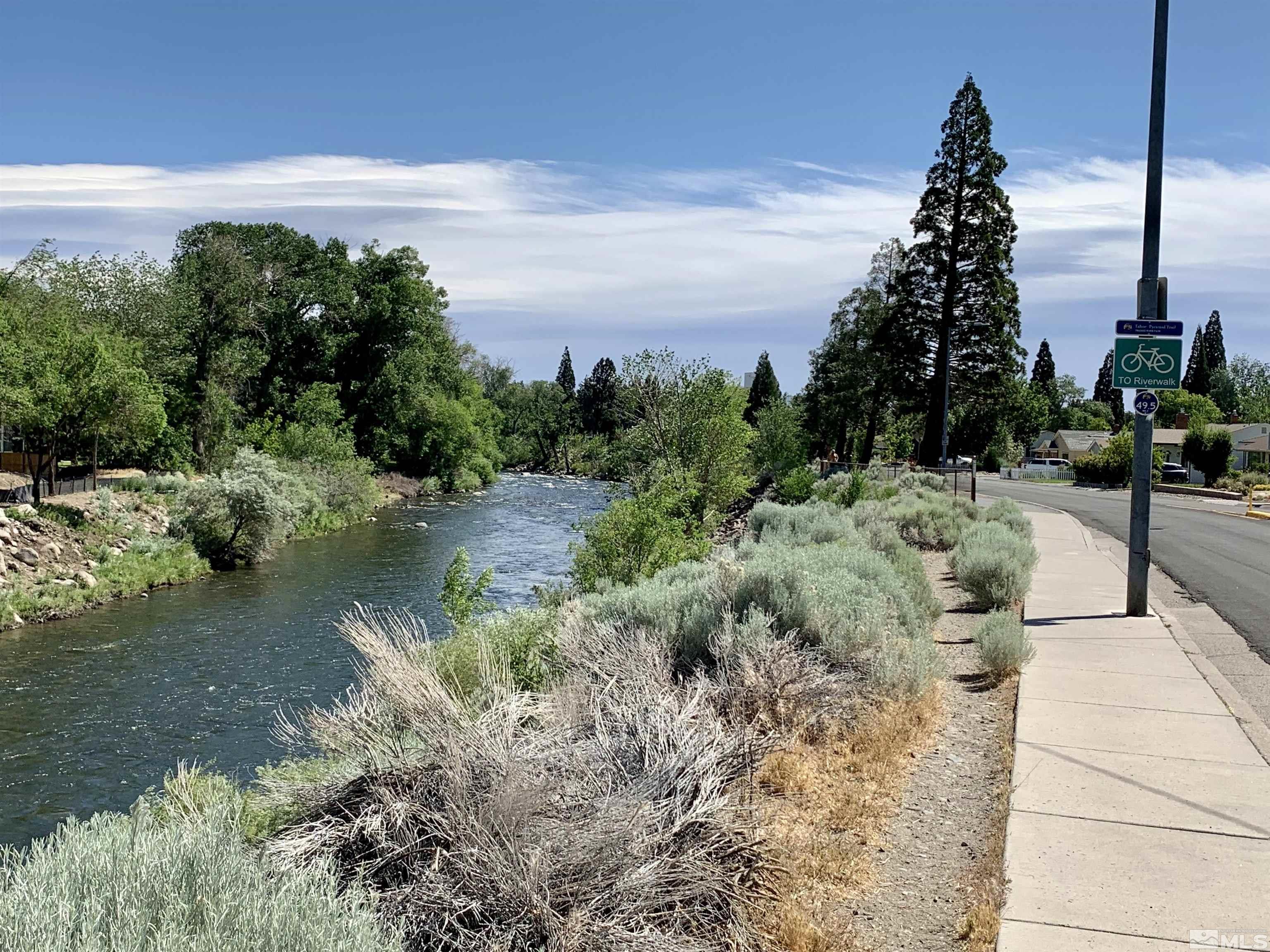 2540 Riviera Street Reno, NV 89509 - Photo 5 of 27 a view of a lake with a yard