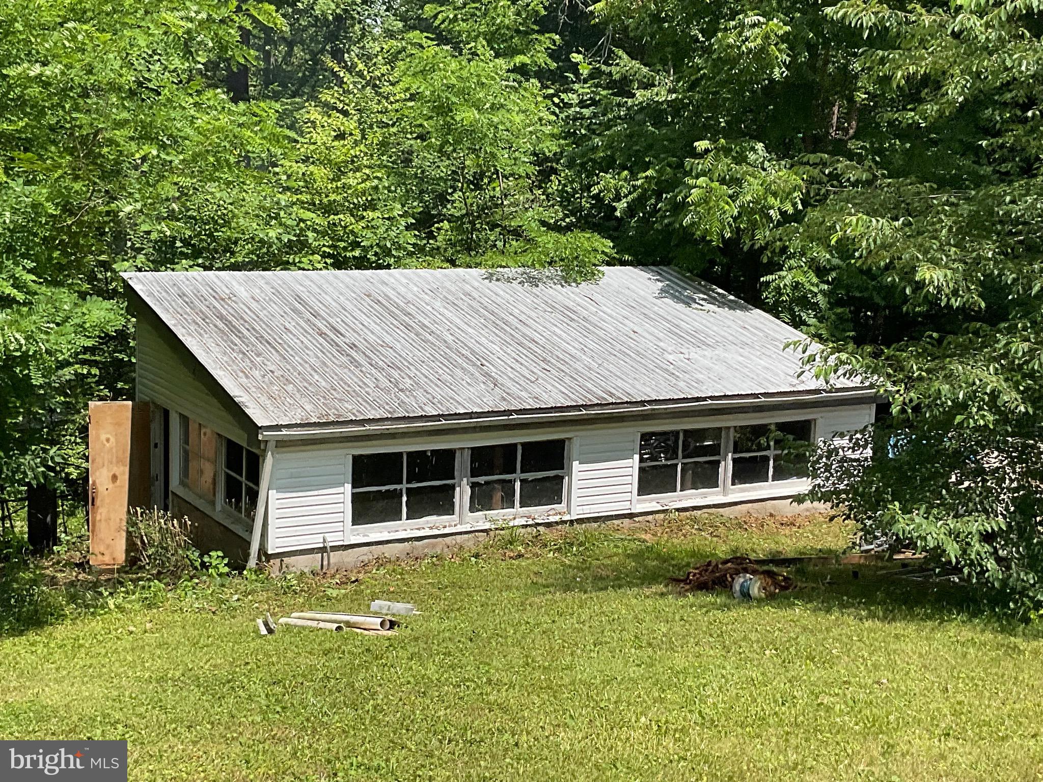 13117 Hazel River Road Rixeyville, VA 22737 - Photo 5 of 32 a house view with a garden space
