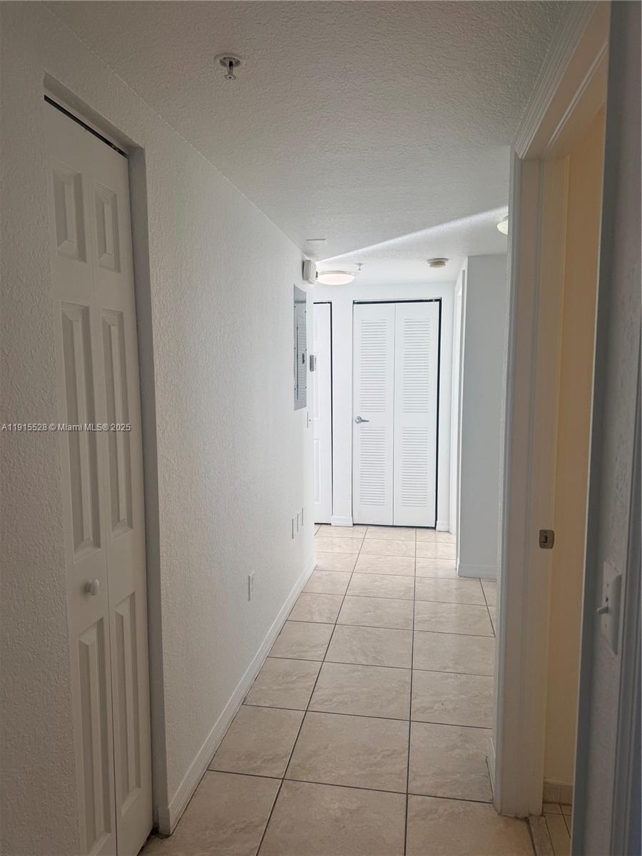 930 Southwest 129th Place, Unit 401 Miami, FL 33184 - Photo 6 of 8 a view of an empty room