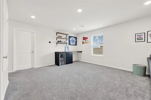 a living room with furniture and a ceiling fan
