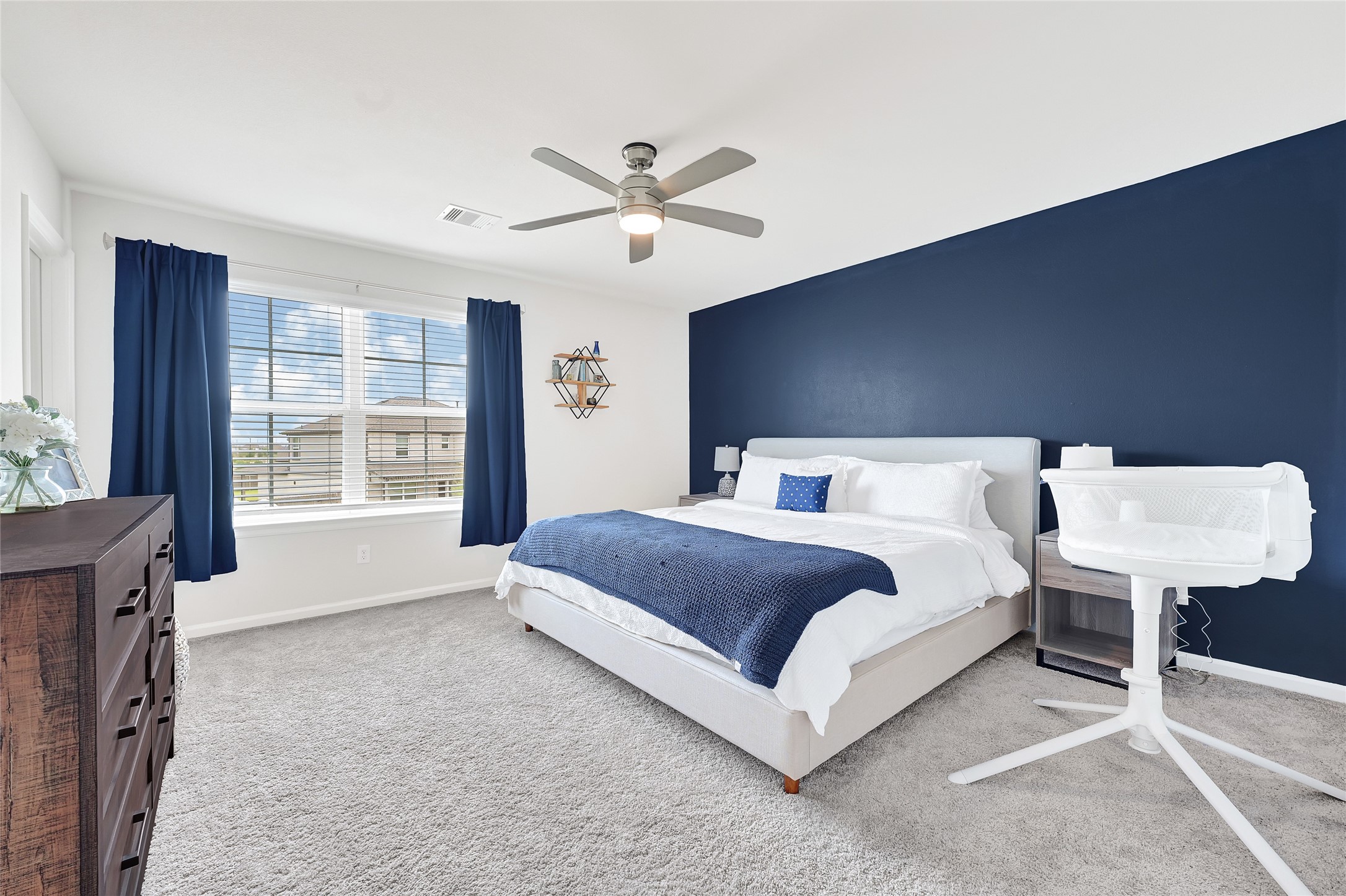 5702 Transformation Trail Katy, TX 77493 - Photo 22 of 32 a spacious bedroom with a bed and a table in it