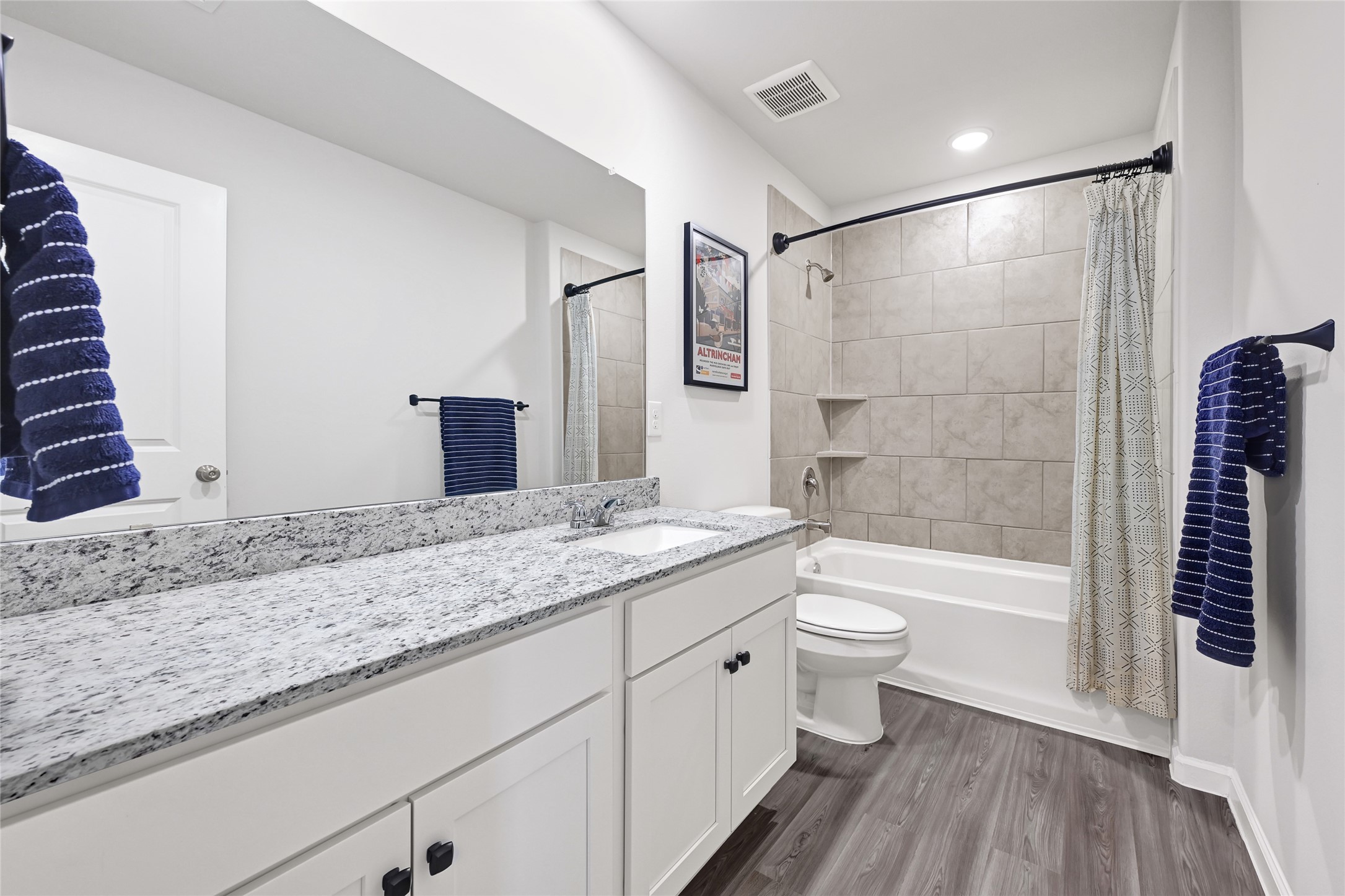 5702 Transformation Trail Katy, TX 77493 - Photo 24 of 32 a bathroom with a granite countertop sink a toilet a large mirror and shower