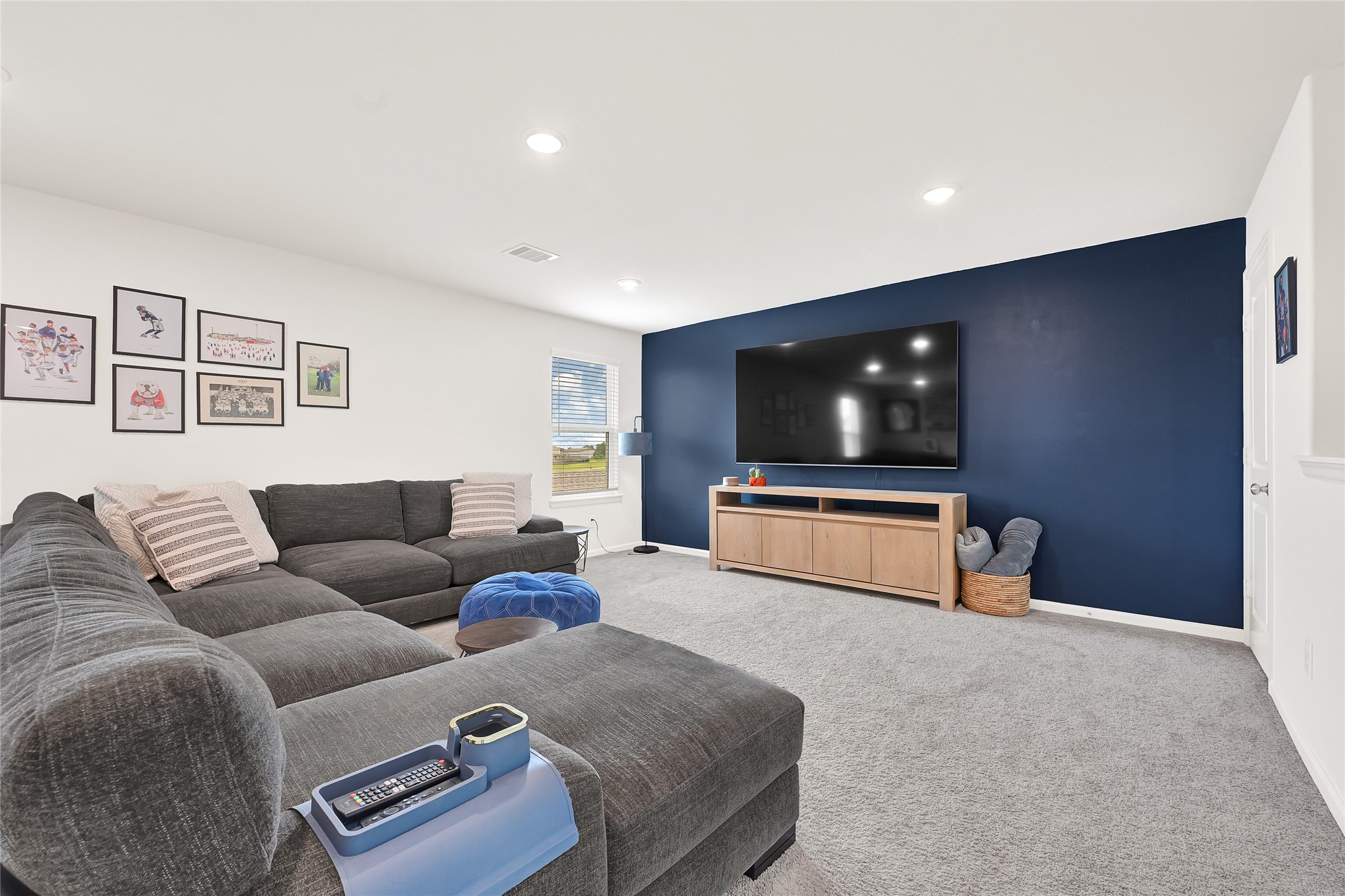 5702 Transformation Trail Katy, TX 77493 - Photo 4 of 32 a living room with furniture and a flat screen tv
